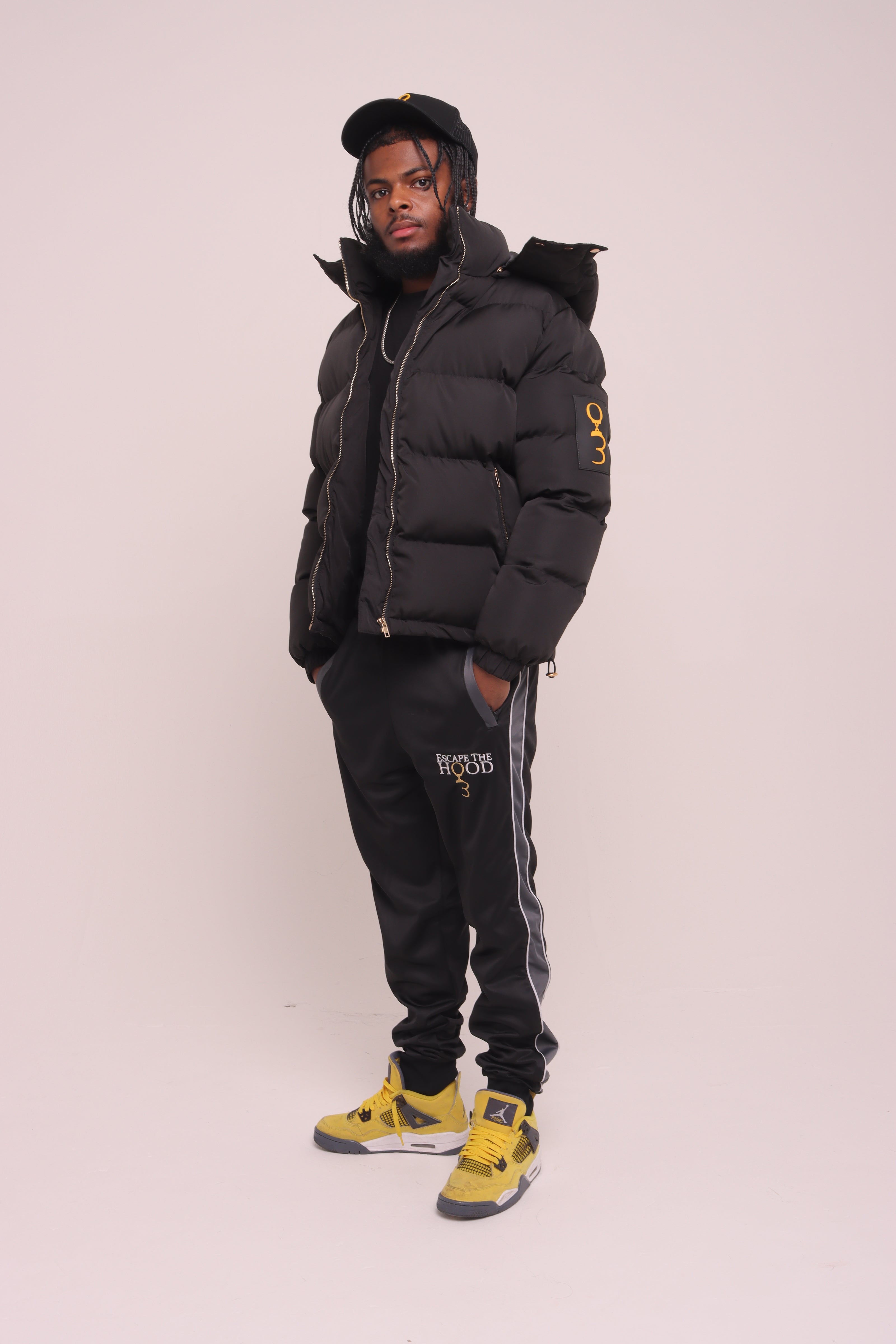 Black "Unlock Your Potential" Puffer Jacket