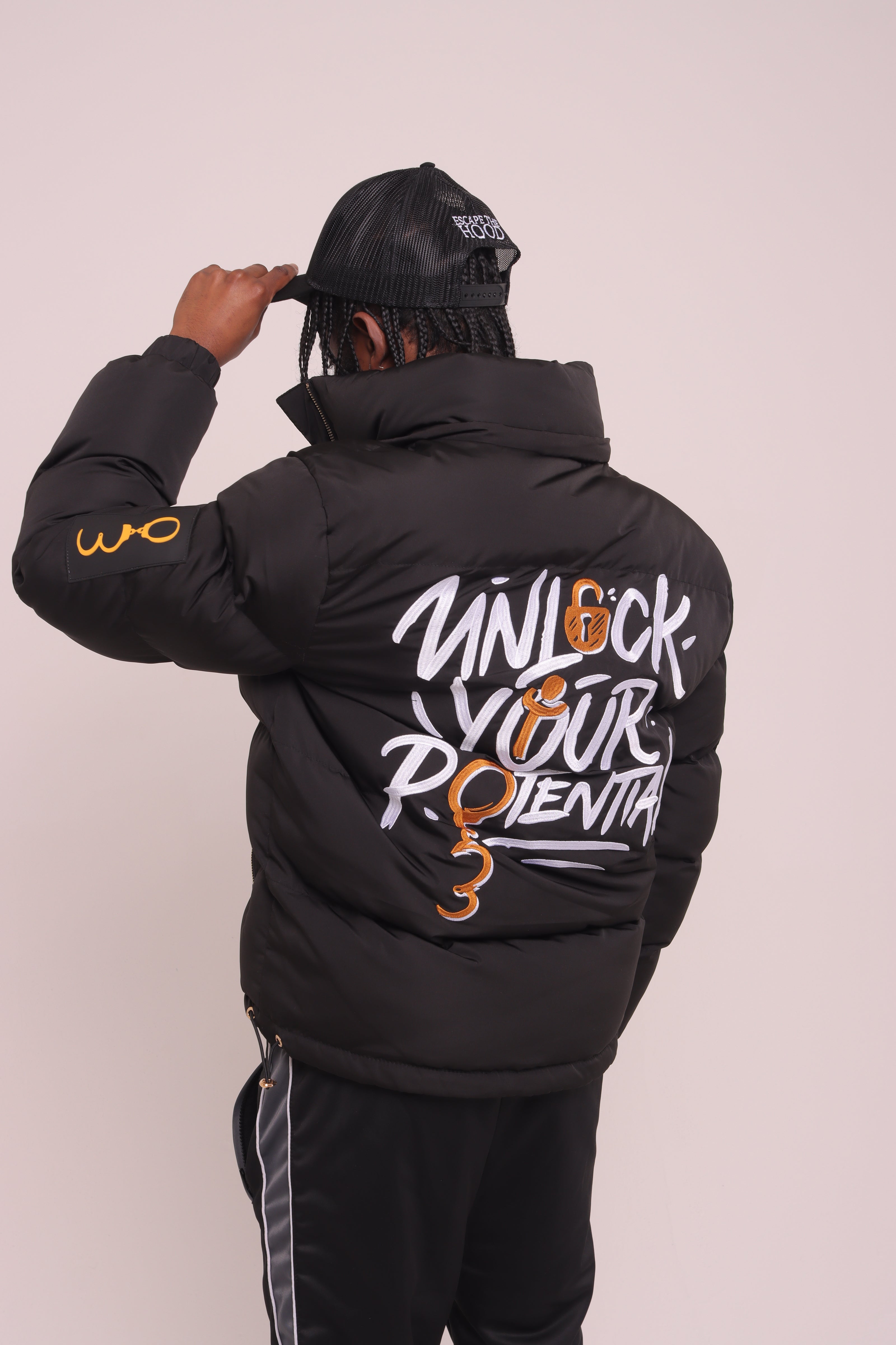 Black "Unlock Your Potential" Puffer Jacket