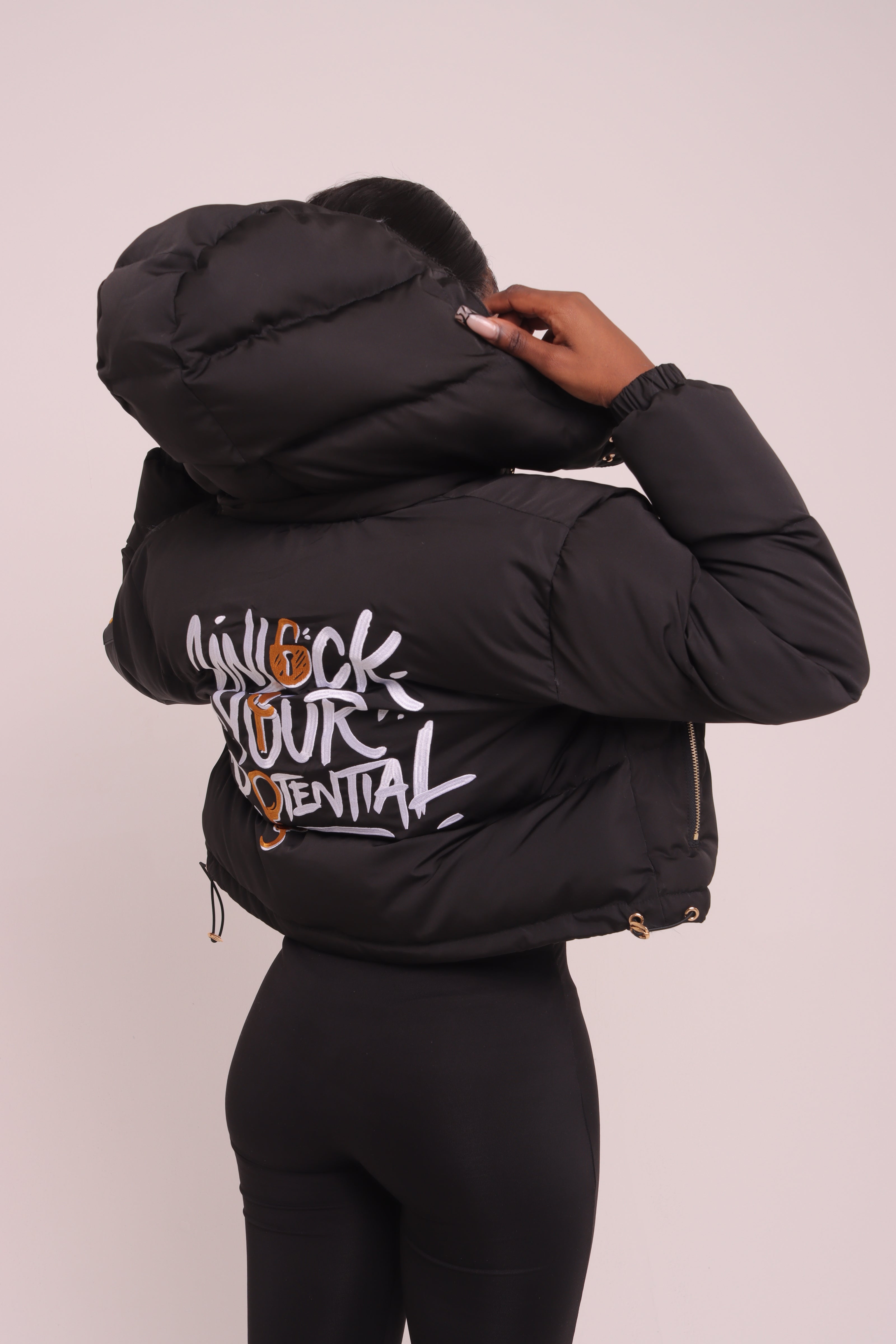 Cropped Black "Unlock Your Potential" Puffer Jacket
