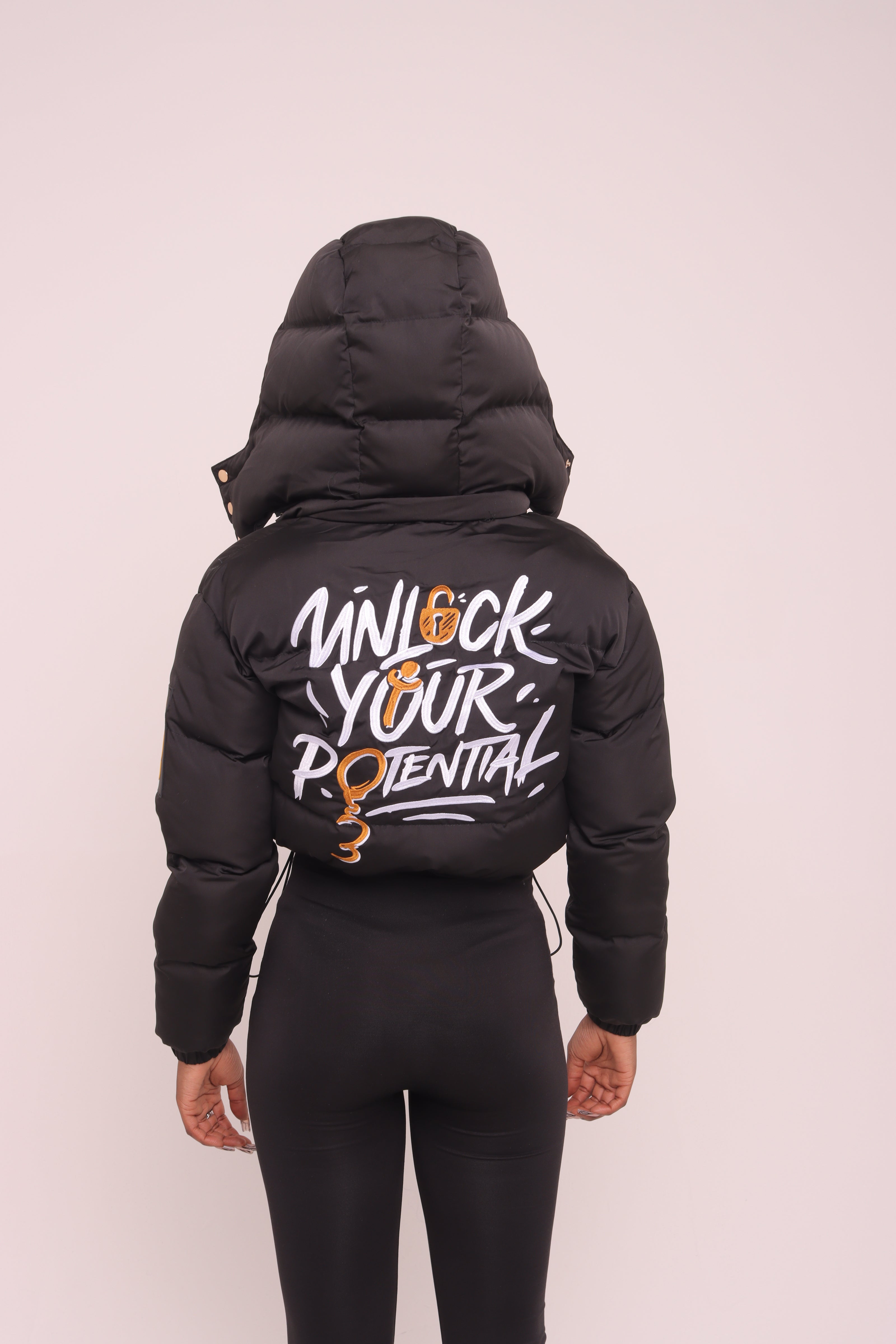 Cropped Black "Unlock Your Potential" Puffer Jacket