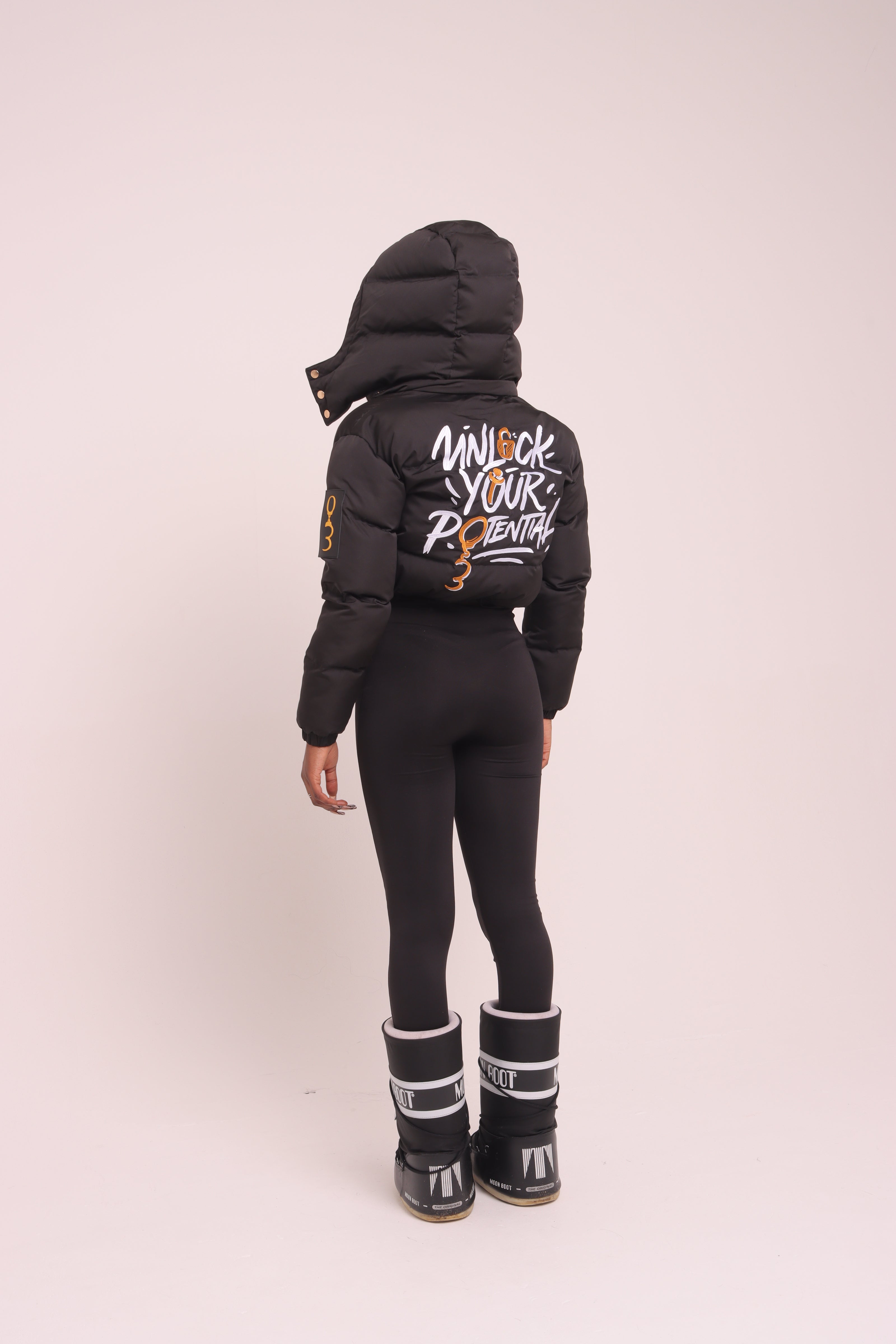 Cropped Black "Unlock Your Potential" Puffer Jacket