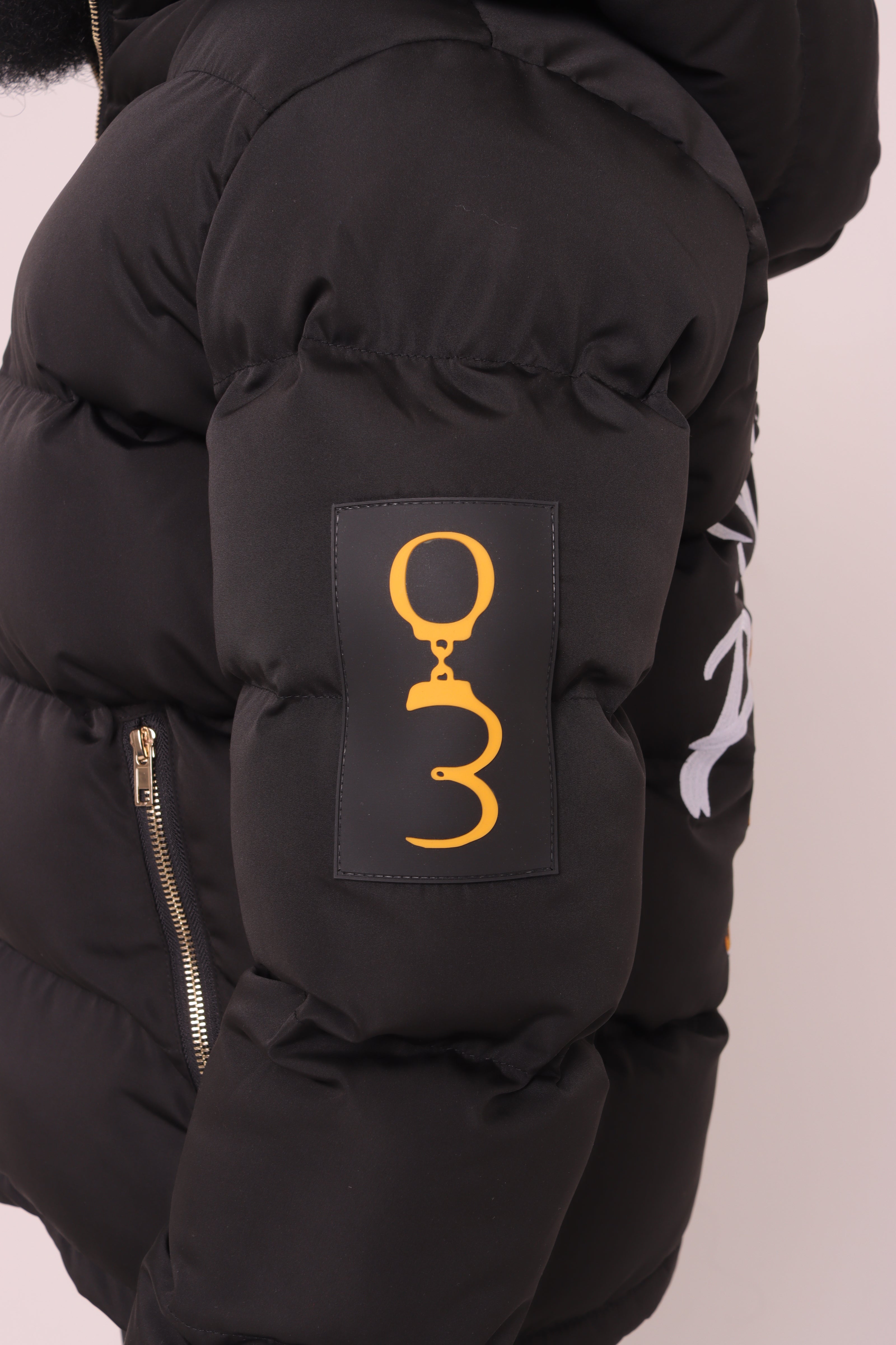 Black "Unlock Your Potential" Puffer Jacket